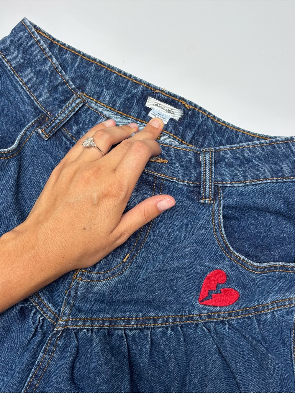 Kimchi Blue Denim Midi Skirt with Red Broken-Heart Patch